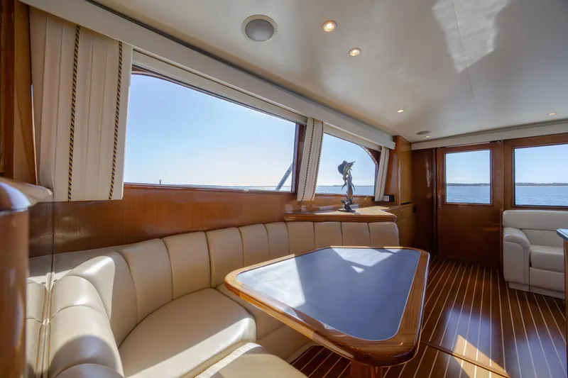 Slide: The Image of Luxurious interior of 2000 Viking 55 Convertible yacht with elegant seating and ocean view. - 56