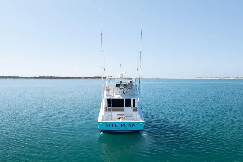 Slide: The Image of Viking 55 Convertible 2000 yacht on calm blue ocean waters. - 6