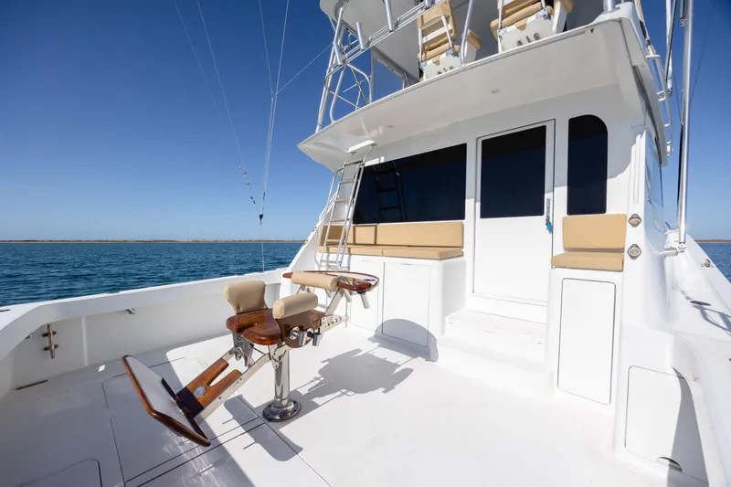 Slide: The Image of 2000 Viking 55 Convertible yacht deck with fishing chairs and ocean view. - 64