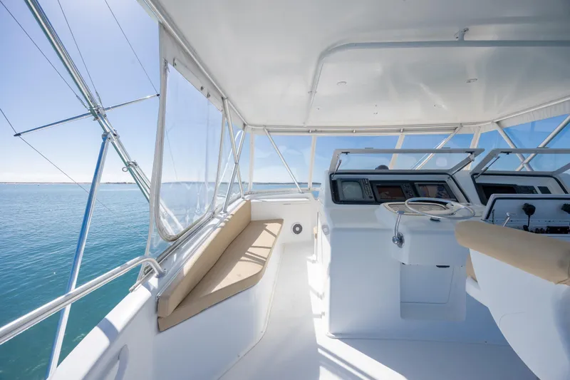Slide: The Image of Helm of 2000 Viking 55 Convertible yacht with ocean view. - 69
