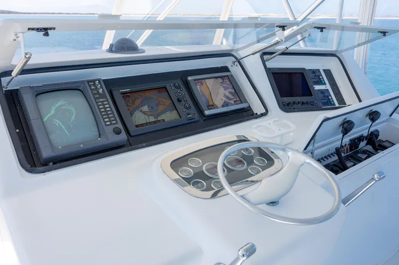 Slide: The Image of Cockpit of 2000 Viking 55 Convertible yacht with navigation equipment and steering wheel. - 74