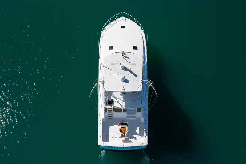 Slide: The Image of Aerial view of 2000 Viking 55 Convertible yacht on clear blue water. - 8