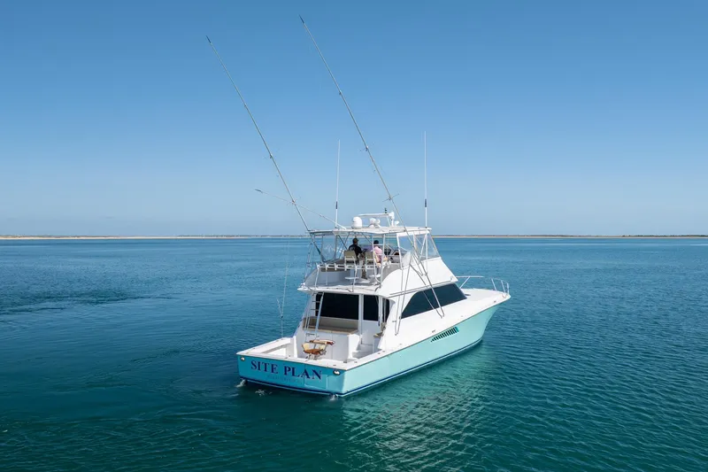 Slide: The Image of Viking 55 Convertible 2000 yacht on calm blue waters under clear sky. - 9