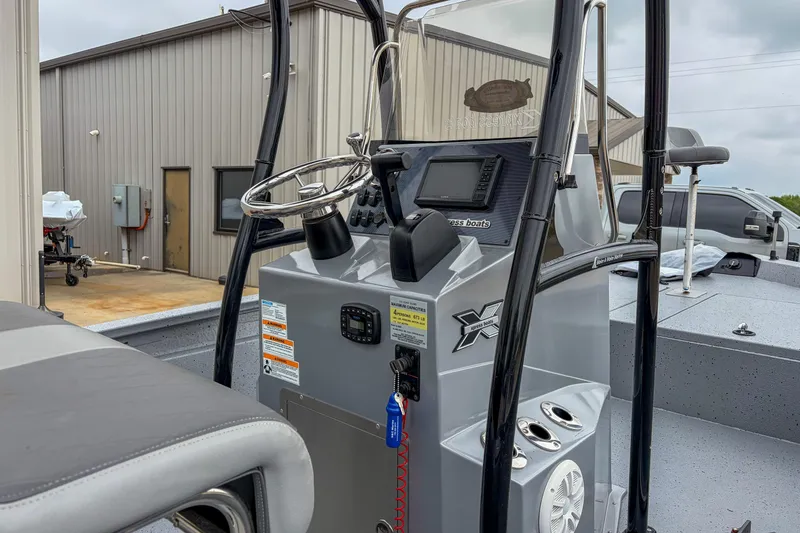 Slide: The Image of 2024 Xpress H190 boat console with steering wheel and navigation system. - 5