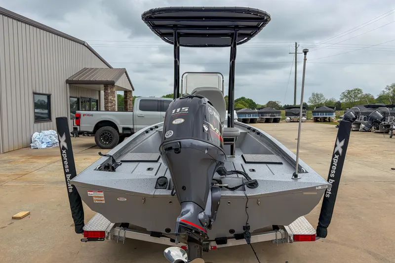 Slide: The Image of 2024 Xpress H190 boat with Yamaha 115 engine, parked outdoors. - 9
