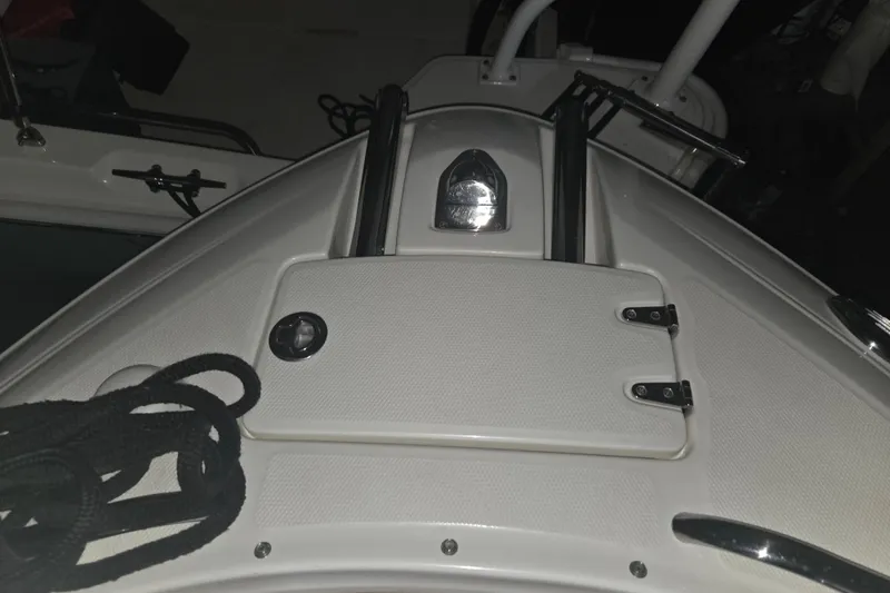 Slide: The Image of 2006 Chaparral 236 SSi boat deck with hatch and rope detail. - 11