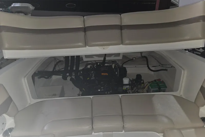 Slide: The Image of 2006 Chaparral 236 SSi boat engine compartment with seating area. - 12