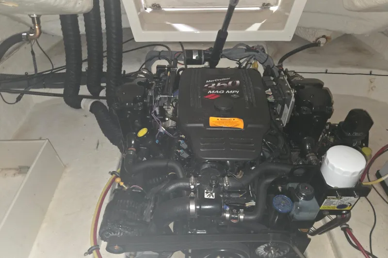Slide: The Image of Engine compartment of a 2006 Chaparral 236 SSi boat with MerCruiser 350 MAG MPI engine. - 14