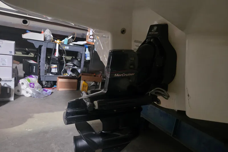 Slide: The Image of 2006 Chaparral 236 SSi boat with MerCruiser engine in a garage setting. - 15