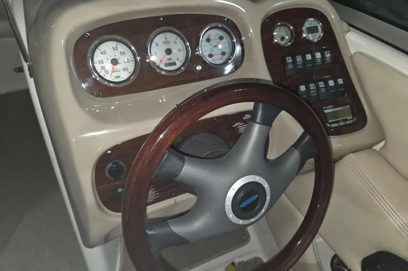 Slide: The Image of Dashboard of a 2006 Chaparral 236 SSi boat with gauges and steering wheel. - 3