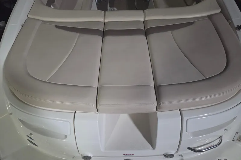 Slide: The Image of 2006 Chaparral 236 SSi boat with beige cushioned seating area. - 6