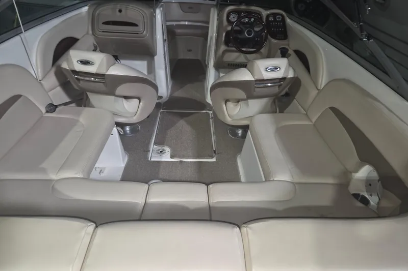 Slide: The Image of Interior of a 2006 Chaparral 236 SSi boat with beige seating and steering console. - 8