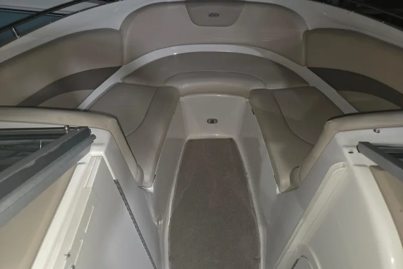 Slide: The Image of Interior view of 2006 Chaparral 236 SSi boat with beige seating and carpeted floor. - 9