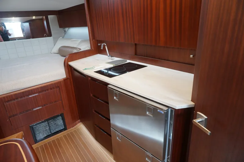 Slide: The Image of Interior of 2021 Jupiter 41 SB yacht with kitchen and sleeping area. - 38