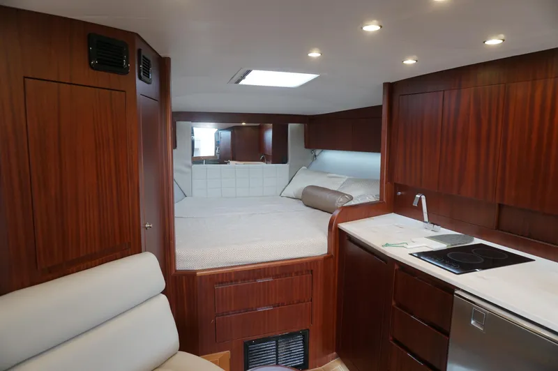 Slide: The Image of Interior of 2021 Jupiter 41 SB yacht with wood finish and kitchenette. - 39