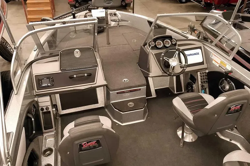 Slide: The Image of 2018 Ranger 1880MS Angler boat interior with steering wheel, dashboard, and seating. - 17