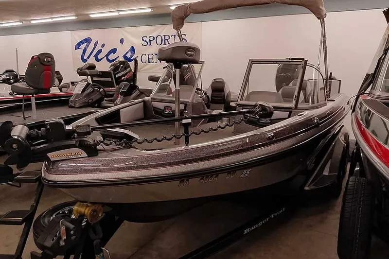 Slide: The Image of 2018 Ranger 1880MS Angler boat displayed at Vic's Sports Center showroom. - 2