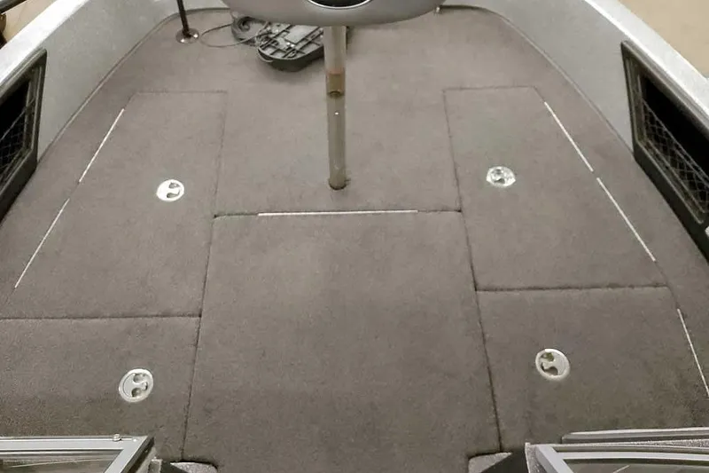 Slide: The Image of 2018 Ranger 1880MS Angler boat interior with carpeted deck and storage compartments. - 21