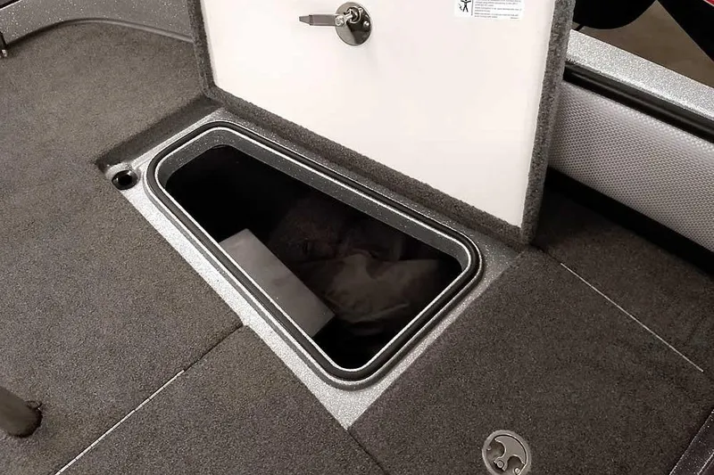 Slide: The Image of Open storage compartment in 2018 Ranger 1880MS Angler boat, featuring carpeted interior. - 24