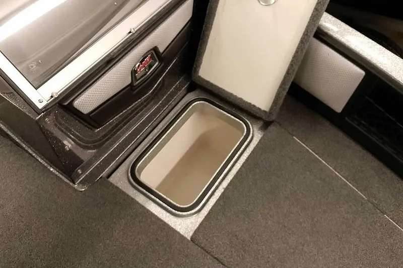 Slide: The Image of 2018 Ranger 1880MS Angler boat storage compartment with open lid, showcasing interior space. - 26