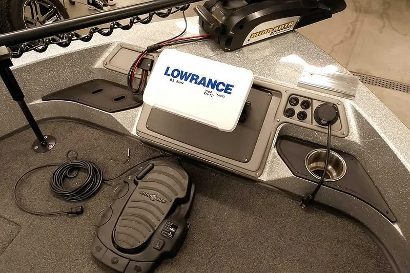 Slide: The Image of 2018 Ranger 1880MS Angler boat dashboard with Lowrance electronics and Minn Kota foot pedal. - 27
