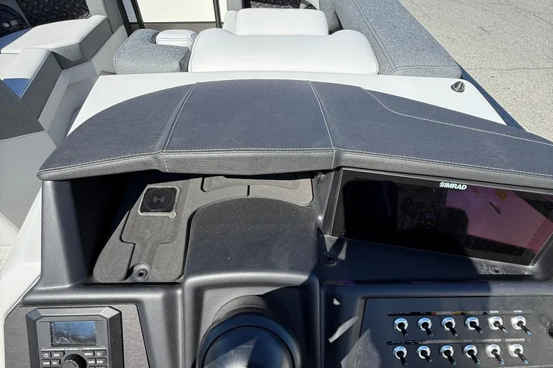 Slide: The Image of Dashboard of 2026 Alera M23Q boat with Simrad display and control panel. - 13