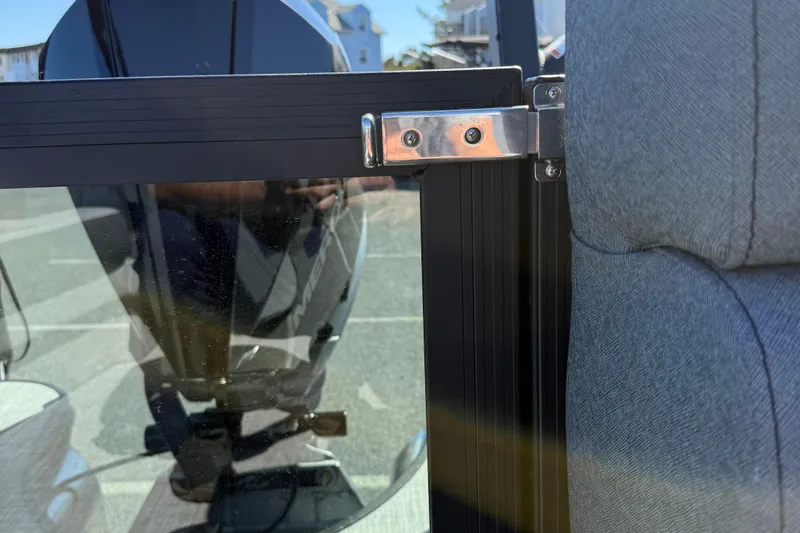 Slide: The Image of Close-up of Alera M23Q 2026 boat door latch and seat detail. - 18