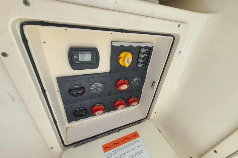 Slide: The Image of Electrical control panel on a 2010 World Cat 290 DC boat. - 16