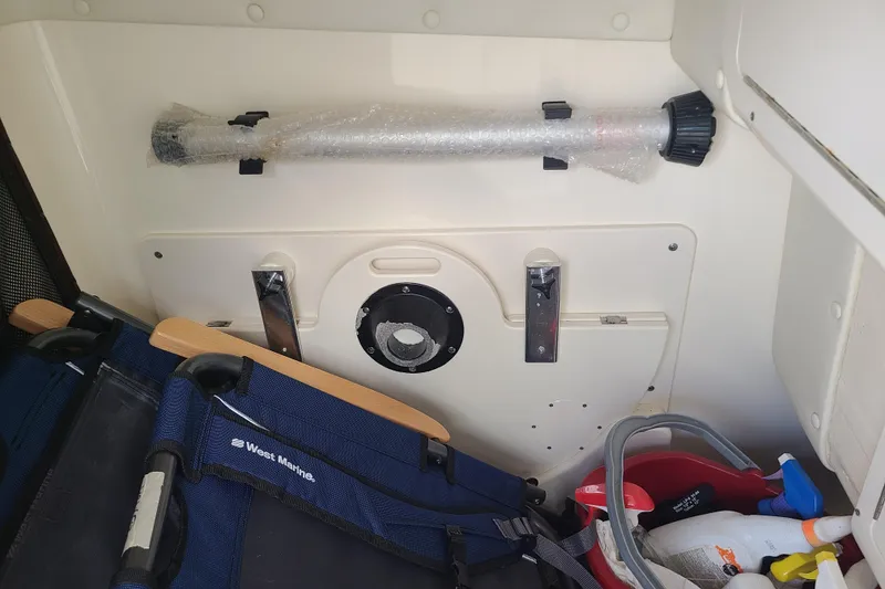 Slide: The Image of Interior of a 2010 World Cat 290 DC boat with storage and equipment. - 17