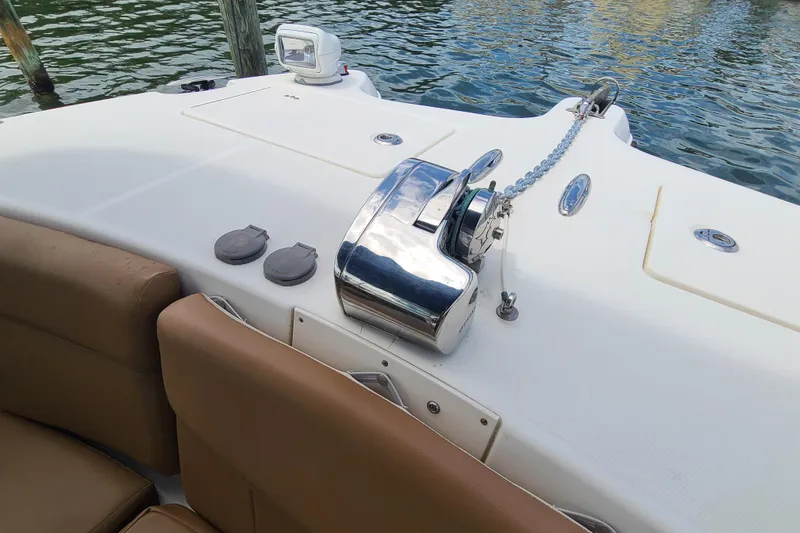 Slide: The Image of 2010 World Cat 290 DC boat deck with anchor winch and seating. - 7