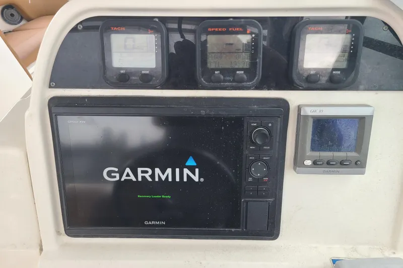 Slide: The Image of Dashboard of a 2010 World Cat 290 DC with Garmin navigation system and gauges. - 8