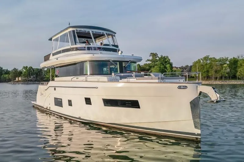 Slide: The Image of Luxurious 2021 Sirena 58 yacht cruising on a serene lake. - 57