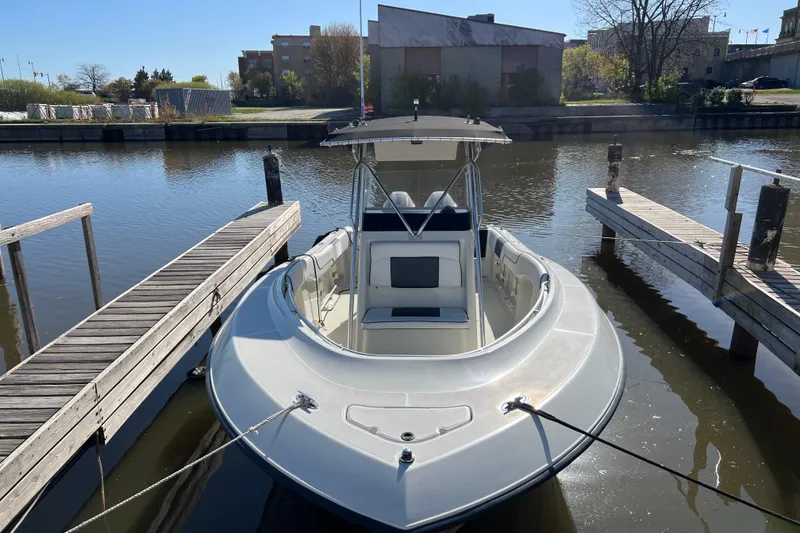Slide: The Image of 2001 Hydra-Sports Vector 2600 CC boat docked in a calm marina setting. - 3