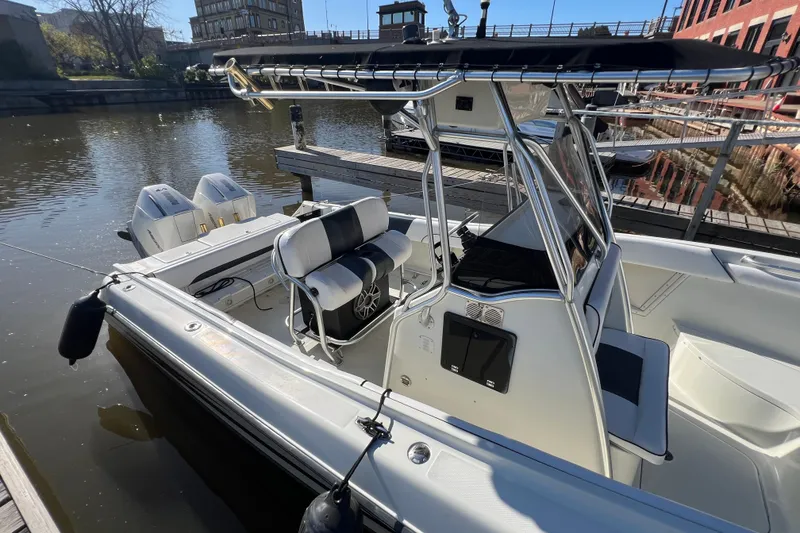 Slide: The Image of 2001 Hydra-Sports Vector 2600 CC boat docked, featuring dual engines and sleek design. - 5