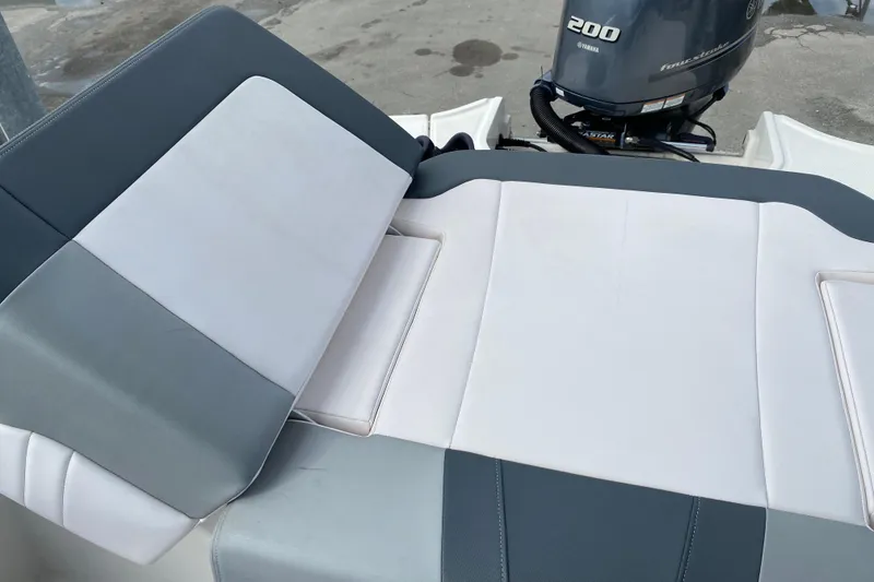 Slide: The Image of 2019 Chaparral 21 H2O Sport boat with Yamaha 200 engine and cushioned seating. - 13