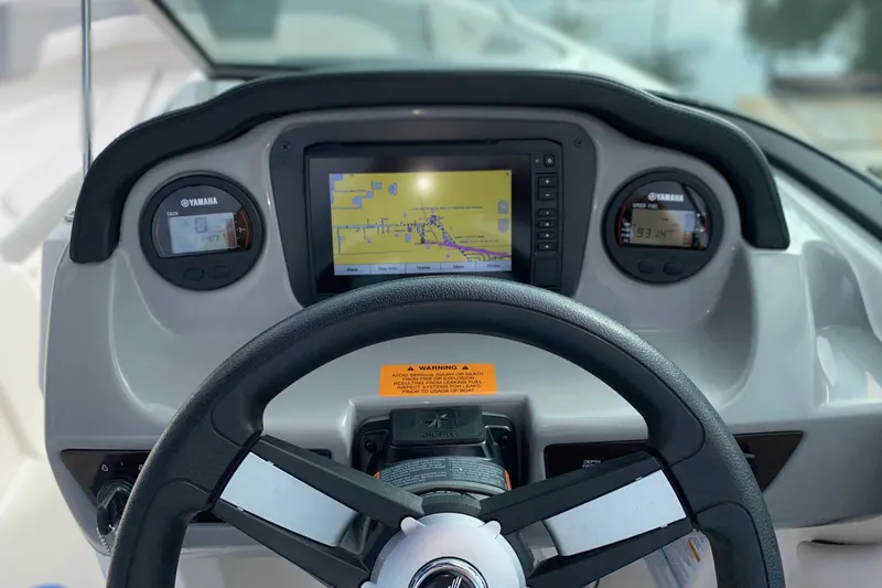 Slide: The Image of Dashboard of a 2019 Chaparral 21 H2O Sport boat with Yamaha gauges and navigation screen. - 7