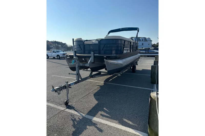 Slide: The Image of 2022 Sweetwater 2386 SB pontoon boat on trailer in parking lot. - 4
