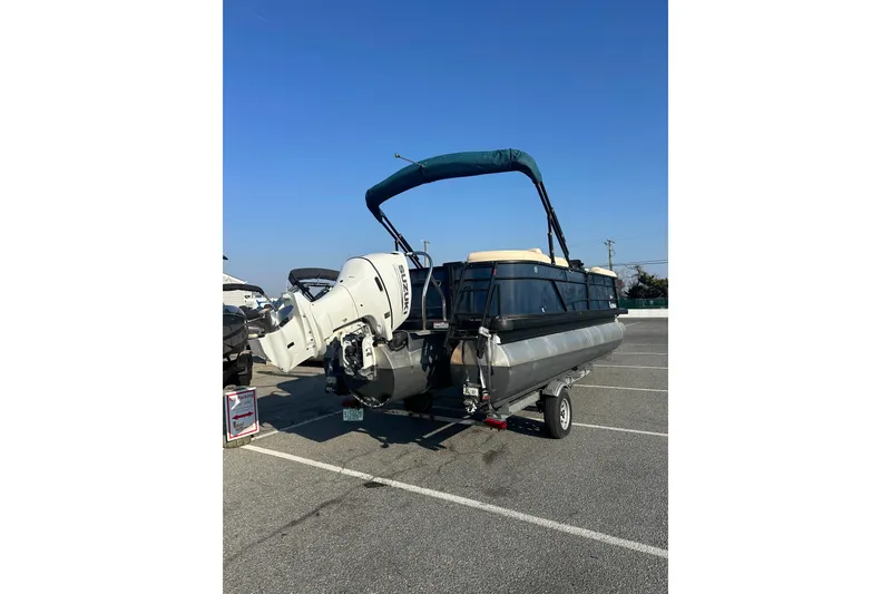 Slide: The Image of 2022 Sweetwater 2386 SB pontoon boat with Suzuki outboard motor on trailer. - 6
