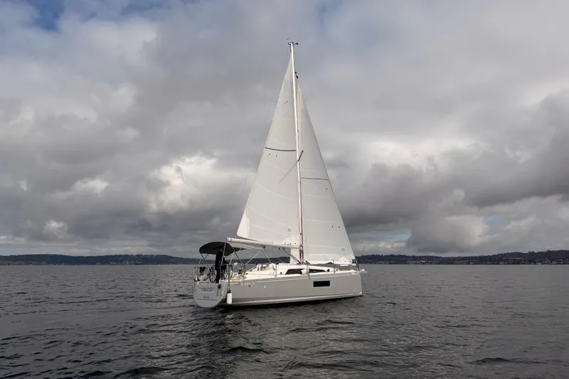 The Image of 2024 Beneteau Oceanis 30.1 sailboat on a cloudy day at sea. - 0