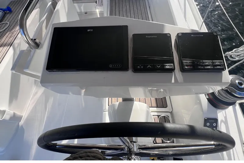 Slide: The Image of Steering wheel and control panel of 2024 Beneteau Oceanis 30.1 yacht. - 11