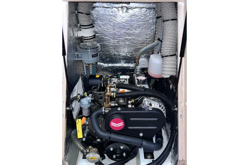 Slide: The Image of Engine compartment of 2024 Beneteau Oceanis 30.1 sailboat, showcasing mechanical components. - 16
