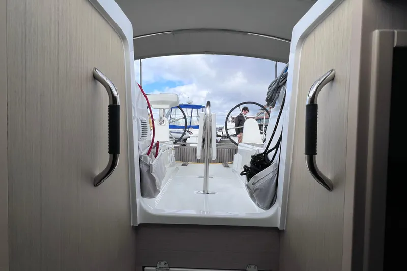 Slide: The Image of Interior view of 2024 Beneteau Oceanis 30.1 sailboat, showcasing cockpit and helm. - 18