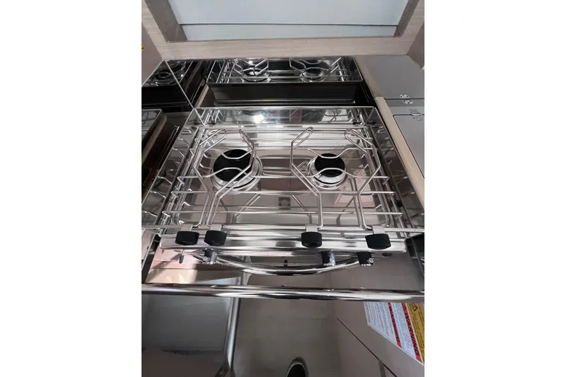 Slide: The Image of Stainless steel stove in 2024 Beneteau Oceanis 30.1 yacht kitchen. - 24
