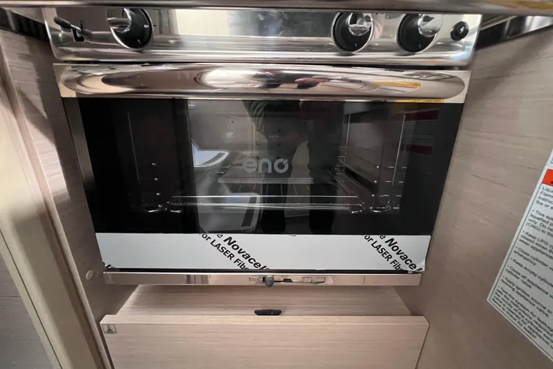 Slide: The Image of Built-in oven in 2024 Beneteau Oceanis 30.1 yacht kitchen. - 25