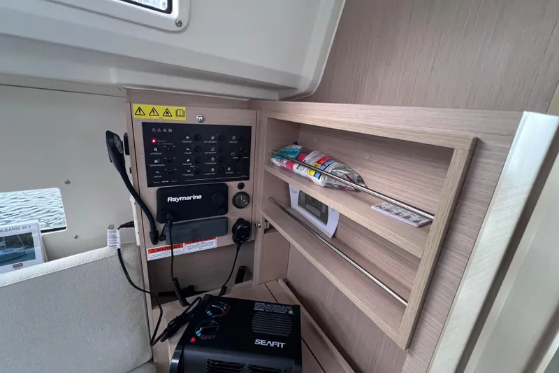 Slide: The Image of Control panel and storage in 2024 Beneteau Oceanis 30.1 sailboat interior. - 29