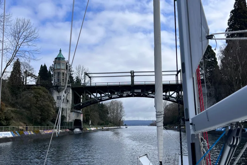 Slide: The Image of Sailing under a historic bridge on a 2024 Beneteau Oceanis 30.1 yacht. - 3
