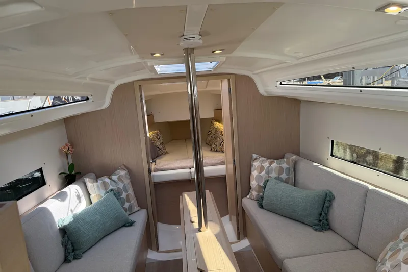 Slide: The Image of Interior of 2024 Beneteau Oceanis 30.1 sailboat, featuring cozy seating and modern design. - 31