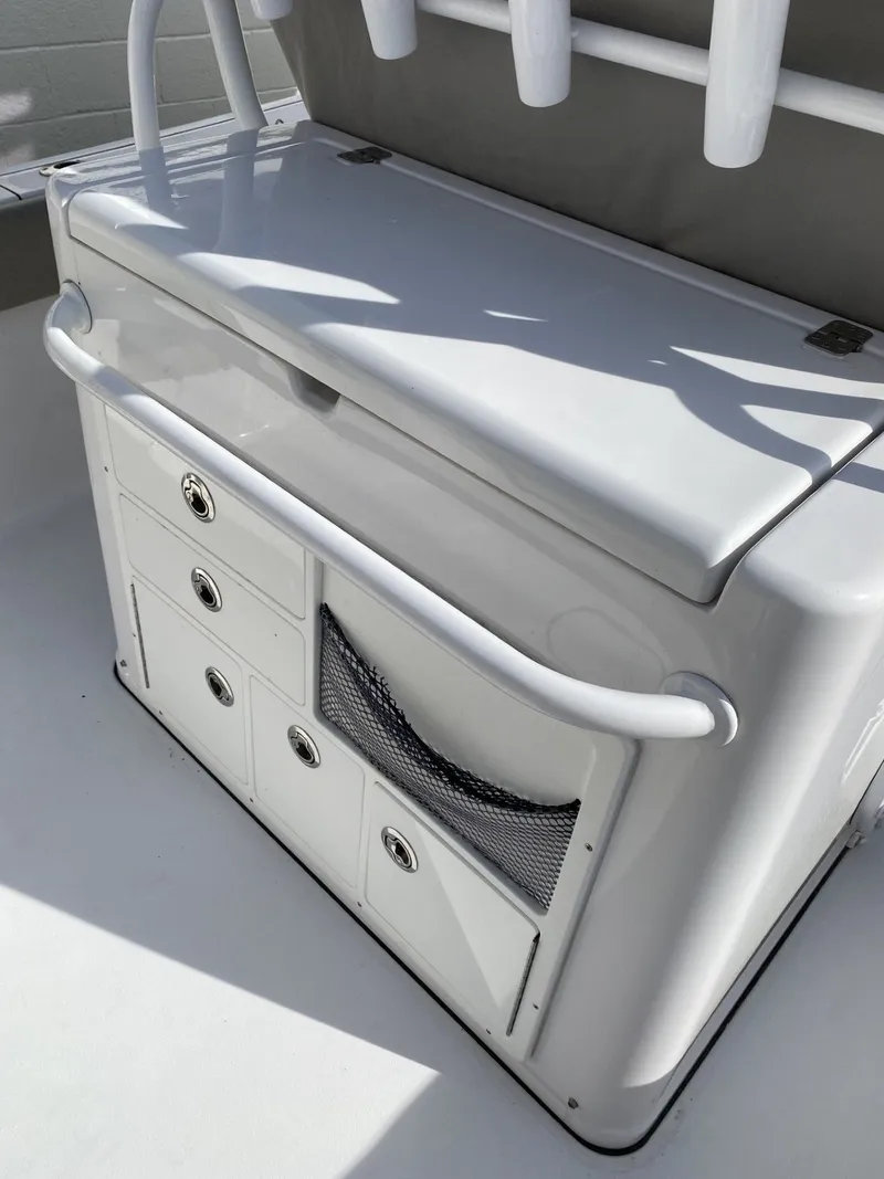 Slide: The Image of 2021 Sportsman Open 282 Center Console storage and rod holders. - 12