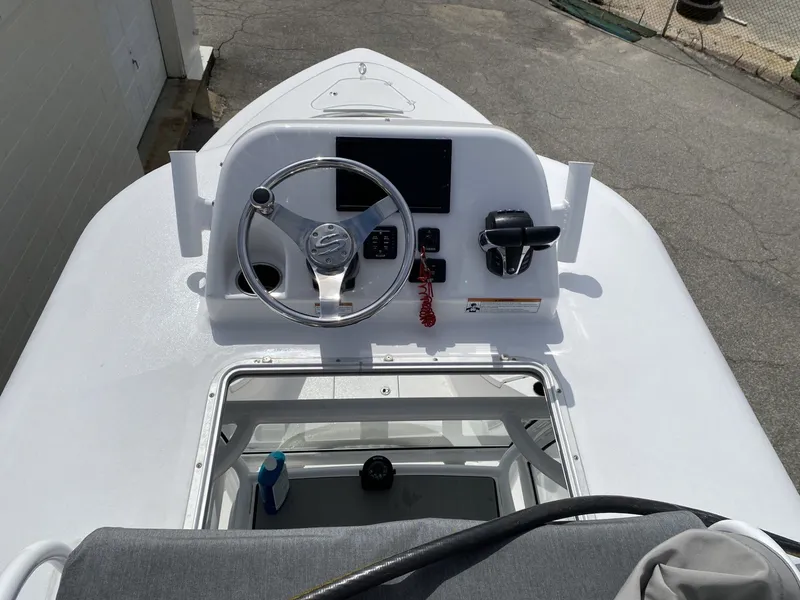 Slide: The Image of Helm of a 2021 Sportsman Open 282 Center Console boat. - 6