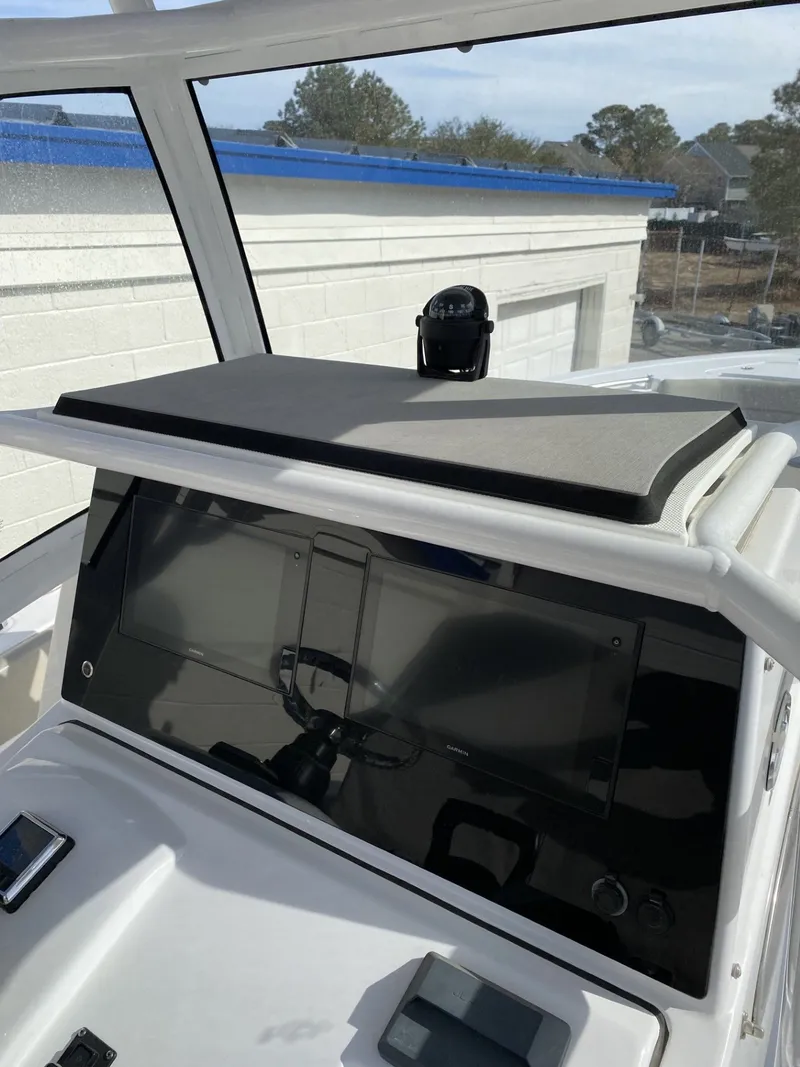 Slide: The Image of 2021 Sportsman Open 282 Center Console helm with electronics. - 7